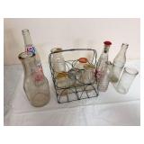 Assortment of vintage milk and soft-drink bottles including embossed and printed examples, Pepsi bottle and wire bottle carrier as shown. Mixed sizes, makers and condition.