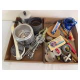 Two flats of vintage kitchen utensils and gadgets including hand-crank beaters, sifters, strainers, wooden utensils, rolling pin, cutters and other kitchen tools, along with a Dunkirk Creamery butter 