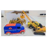 Group of die-cast vehicles and equipment including Cooper Armored Cord Tires delivery truck, Caterpillar 225 tracked excavator, Caterpillar D11R bulldozer and yellow Deist Safety vehicle as shown.