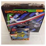 Dromida Voyager radio-controlled airplane in original box and Hot Wheels Speed Racer R/C Racer NGT in original packaging. Both include their respective packaged components as shown.