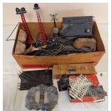 Large assortment of model railroad track, switches, elevated signal towers, crossing signal, scenery pieces, fencing and assorted accessories as shown. Includes both loose and boxed components.