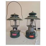 Coleman Models 228H & 228E Big Hat Lanterns – Marked 11/74 & 6/52. Pair of large green double-mantle lanterns with wide green porcelain ventilators, clear globes and wire bail handles; show finish w