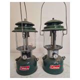 Coleman Models 220H & 220F Lanterns – Marked 8/74 & 12/66. Green double-mantle pressure lanterns with matching porcelain ventilators, clear globes and wire bail handles; shows general age-related we