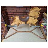 Vintage Spring Bouncing Horse & Lincoln Logs. Large molded horse riding toy suspended on coil springs within a metal frame with wooden hand and foot grips; Lincoln Logs are also included