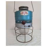 Thermos outdoor lantern Model 8321 with blue metal housing, clear lower globe, wire stand and carrying bail; marked 5/67. Shows surface wear, oxidation and age-related use.