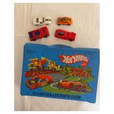 Vintage blue Mattel Hot Wheels 12 Car Collector’s Case with four loose toy cars as shown. Case features illustrated construction equipment and vehicles and shows age-related wear and soiling.