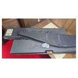 Three long gun cases including two molded hard cases and one Pit Bull padded soft case marked “It Floats!” as shown.
