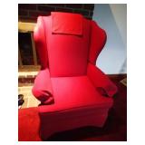 Red upholstered wing chair