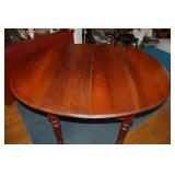Round wood table with folding sides