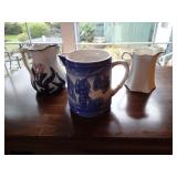3 antique pitchers as shown