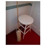Small white stool and brush