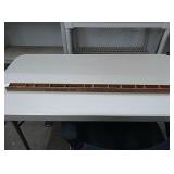 Decorative piece made with yardsticks with small