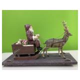 Santa on sleigh and reindeer