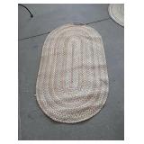 Tan and burgundy rug approx 4.5ft × 2.5 ft