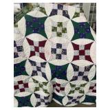 Green and white quilt - appears hand Stitched -