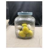 Glass jar with lid....has decorative  eggs and