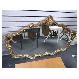 Gold colored mirror. Approx 50" x 35"