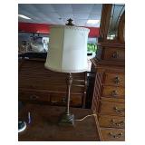 Gold colored lamp. Shade has some damage- approx