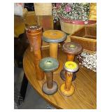 5 decorative antique spools of various sizes used