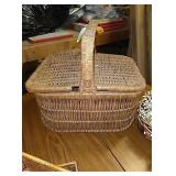 Vintage picnic basket filled with  various other