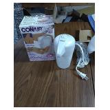 Conair heated lotion dispenser appears new and an
