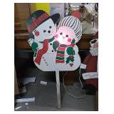 One snowman couple and one Santa wood yard