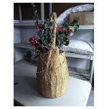 Large wicker basket with floral arrangement  in