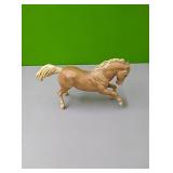Breyer tan horse....approx 8"tall when standing