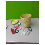Flour canister full of misc cookie cutters