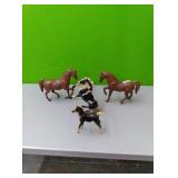 4 horse figurines...smallest horse is Breyer but