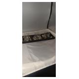 Decorative candle holder about 1 ft long