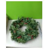 Pine wreath with pinecones and berries. Lights