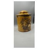 Vintage porcelain cookie jar with fruits on front