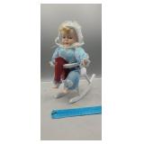 Musical Porcelain Doll on Rocking Horse
