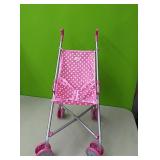 Pink with white polka dots doll stroller