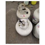 2 propane Pigs.  1 Empty    1 partial