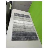 New Grey throw rug....soft....approx 32"×19"