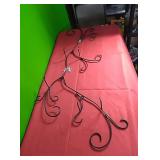 Metal scrollwork wall hanging plant holder. Has