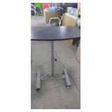 Adjustable roll around table 20"x32" ( used)