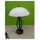 Black decorative lamp with frosted glass shade.