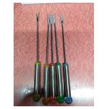 5 fondue forks with various colored handles