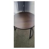 NEW Round End TableMeasurements: 23.5" diameter