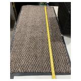 Brown rug with rubber back