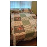 Quilt  Queen Size with Pillow Shams and pillows.