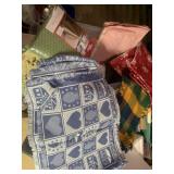 52qt storage tote with lid full of table cloths &