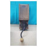 Antique Wall-Mounted Coffee Grinder, likely from