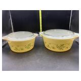 2 yellow Pyrex bowls with lids