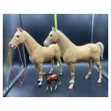 3 plastic horses