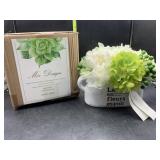 New silk flowers in stone pot