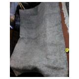 Gray rug. Shaggy gray rug. Measures 90in x 60in.